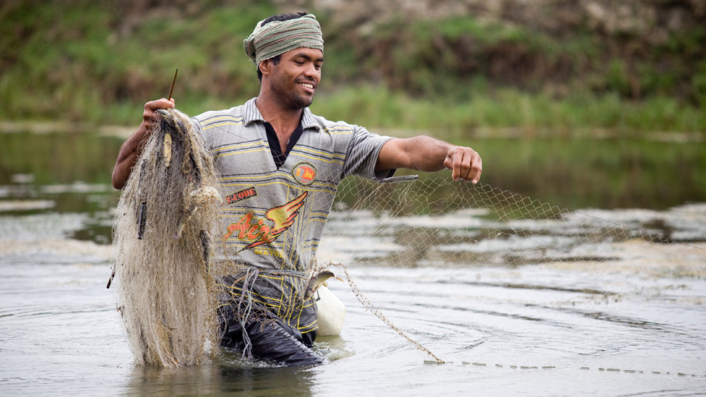 Pobitra at his shrimp pond