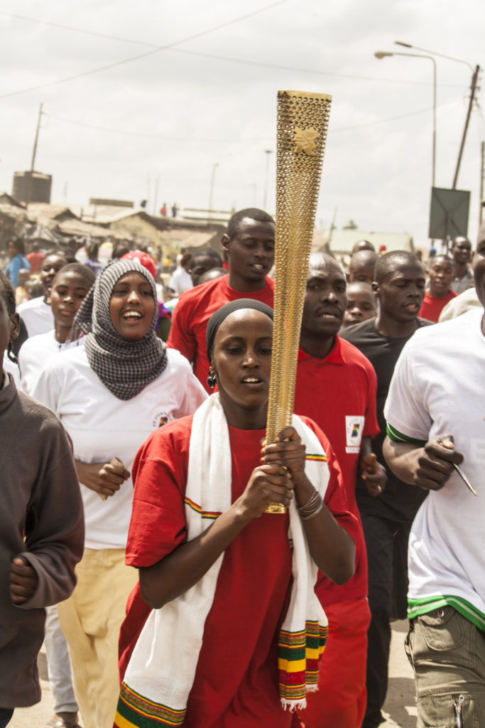 Catherine Wanjiku leads the marathon with the torch