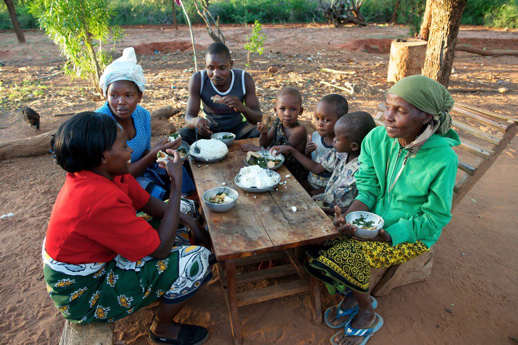 Emily's family sharing a meal, Kenya. Her story is told as part of the Emmaus Meal.