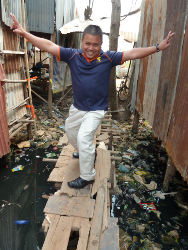 Rotha on the 'bridge' into Samrong Mean Chey - Connect2 Cambodia