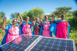 Women in Kenya with solar panels