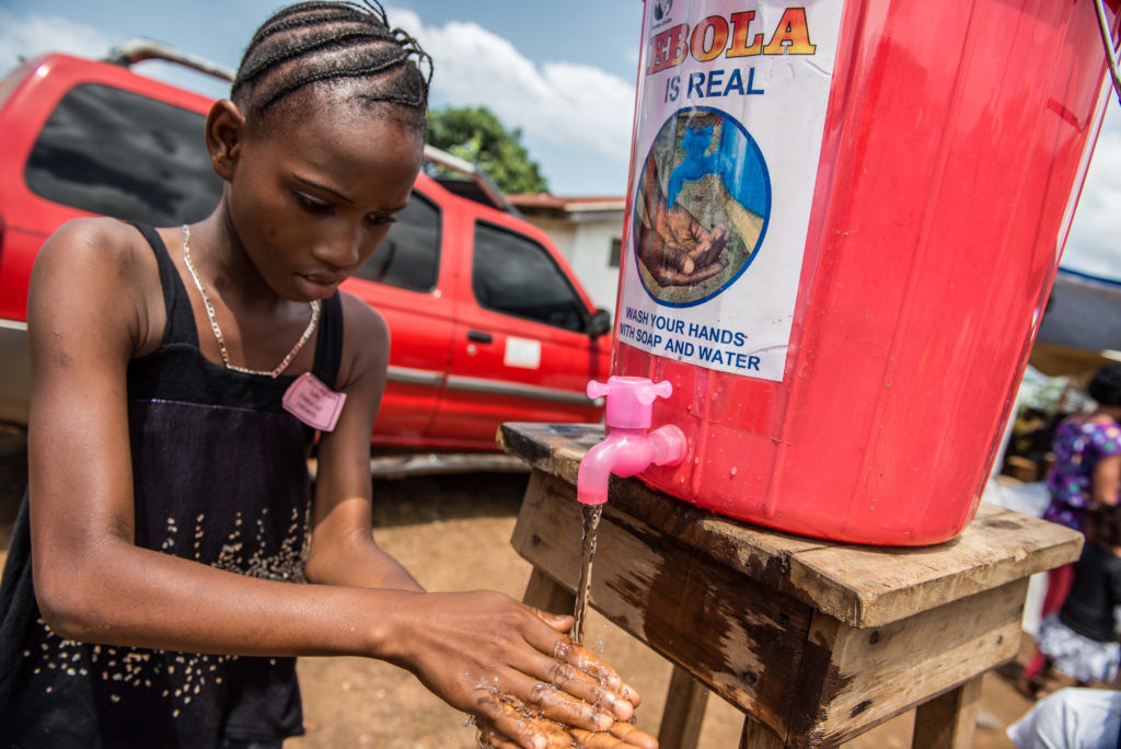 Ebola_hand washing_CAFOD_Caritas_Sierra Leone_Tommy Trenchard_Oct2014