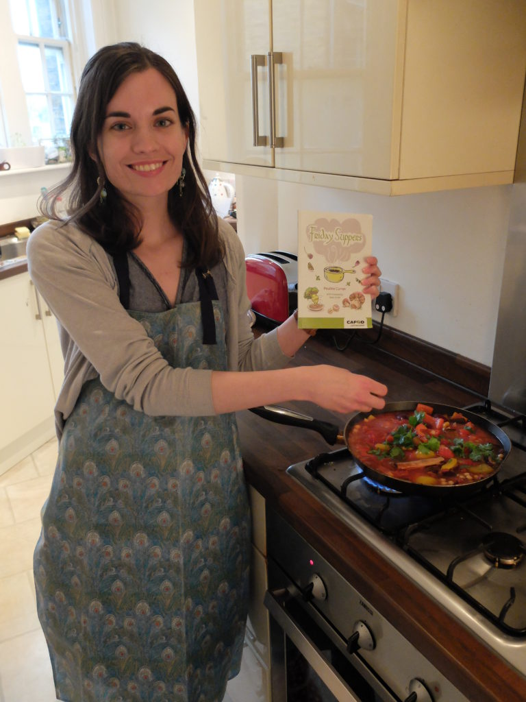 Rachel McCarthy cooking a recipe from the Friday Suppers cookbook