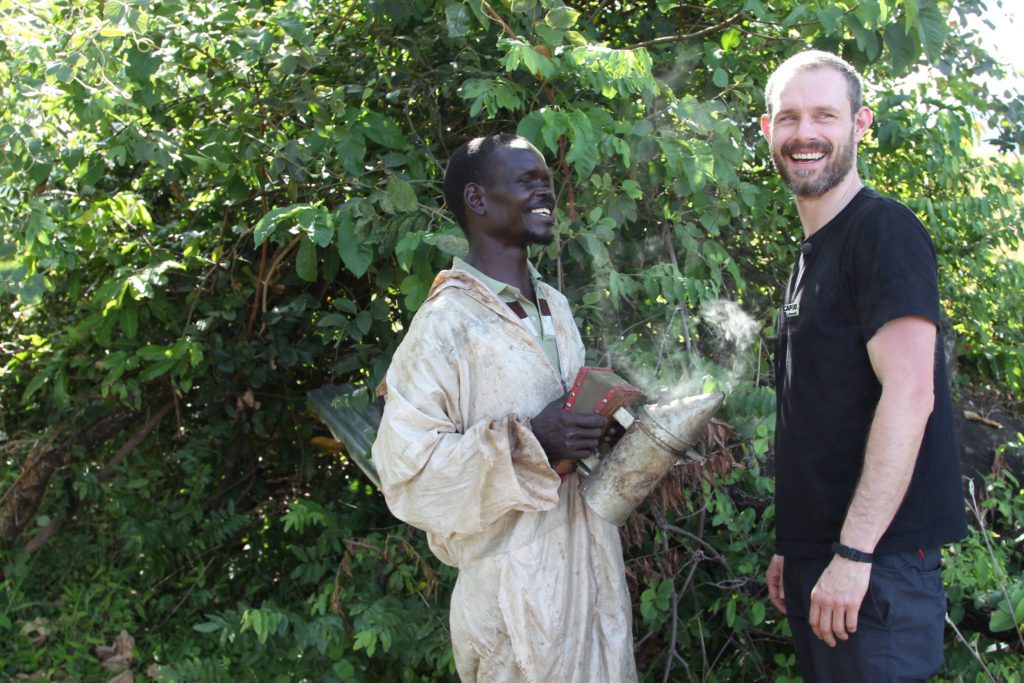 Ben Price with beekeeper Paul, Uganda, CAFOD