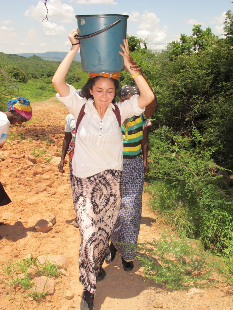 Leila carrying water