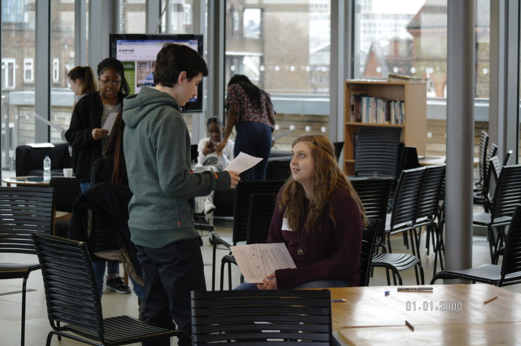 Young leaders meeting in London practise their presentation skills.