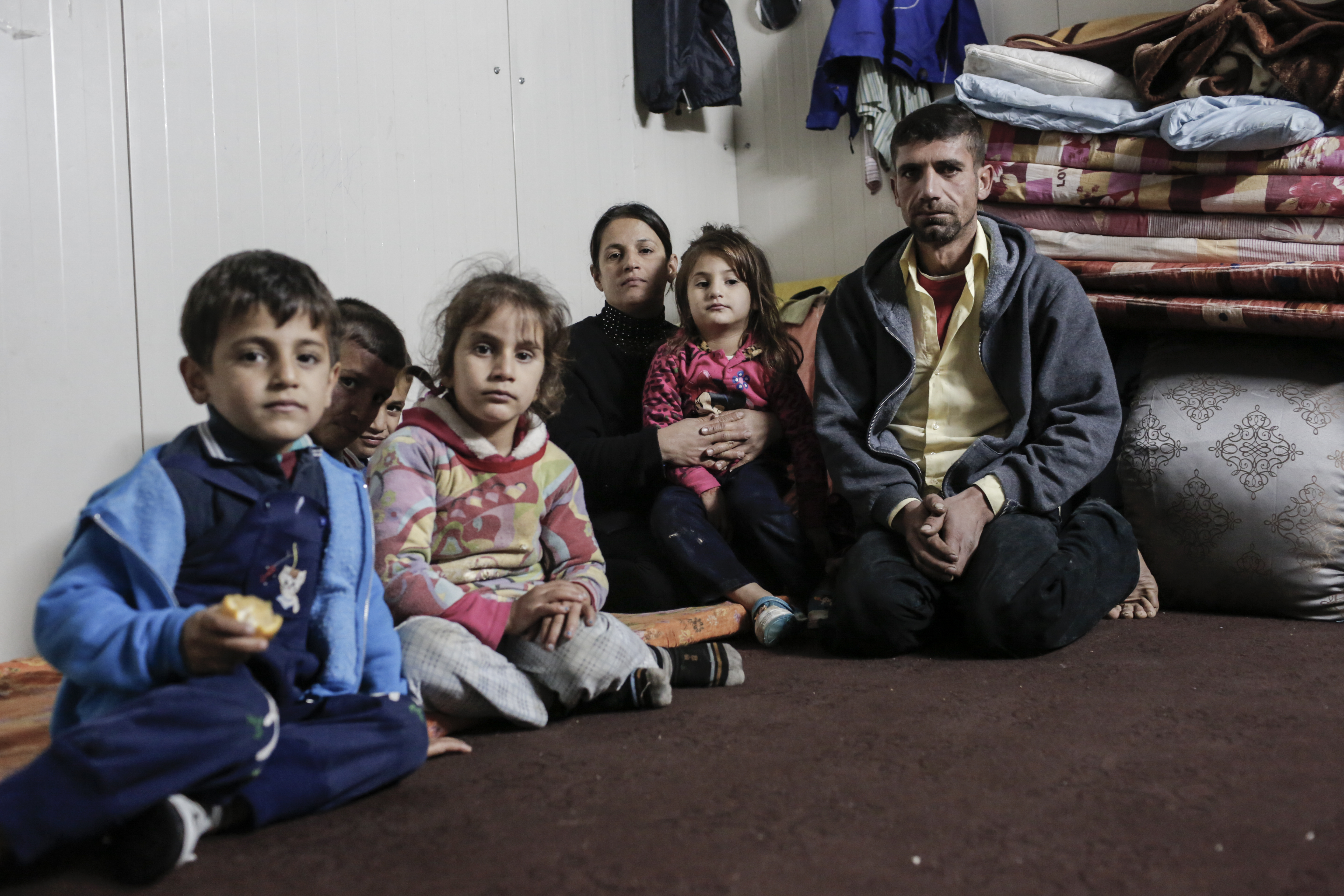 An Iraqi family who have been forced from their home by fighting, who now receive support from CAFOD's partner.