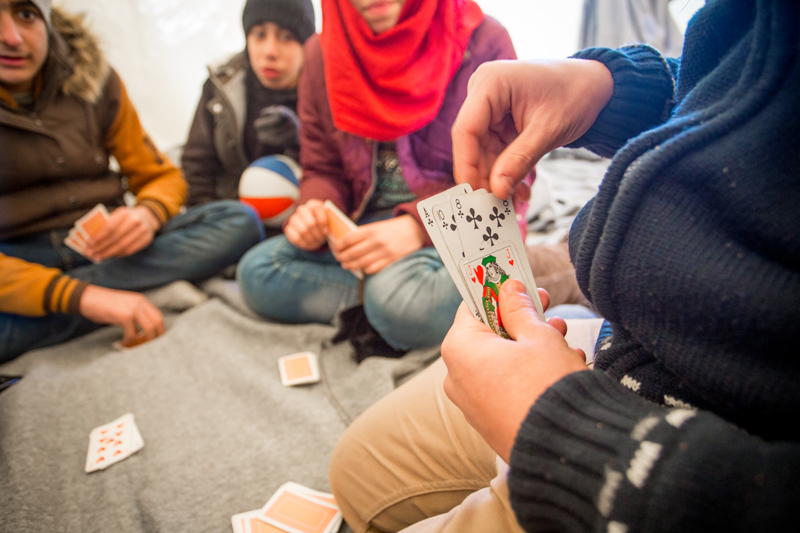 Refugees play games to pass the time