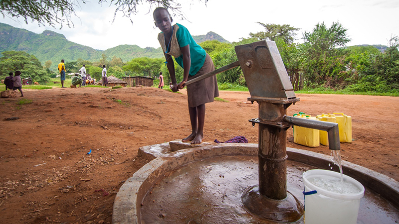 Proscovia in Uganda at water pump