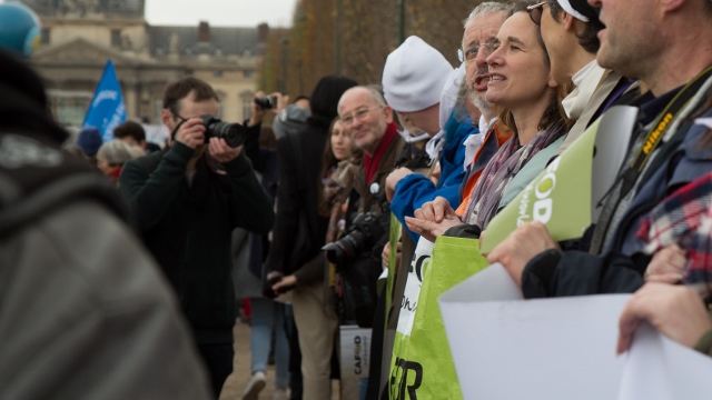 Liam taking photos of CAFOD supporters calling for climate change action in Paris (Judith Tooth)