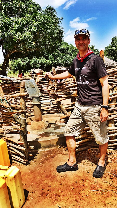 Justin visiting one of CAFOD's boreholes in Uganda