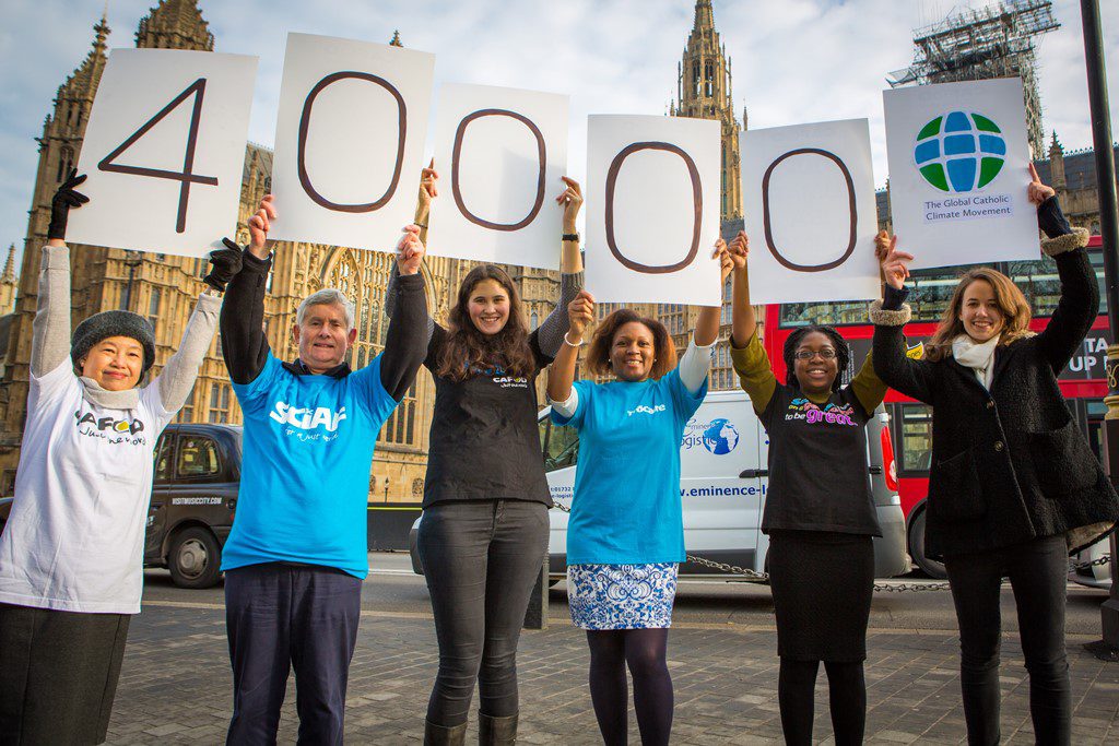 CAFOD Campaigns manager Sarah Croft (right) delivering climate petitions