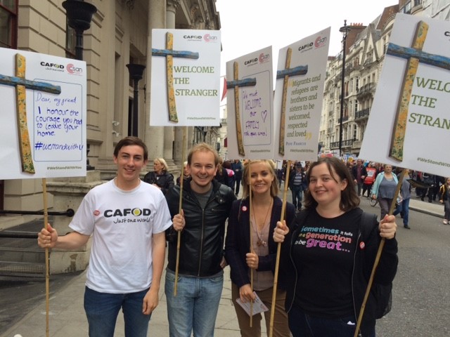Chris Bird (far left) and friends march in London in solidarity with refugees.