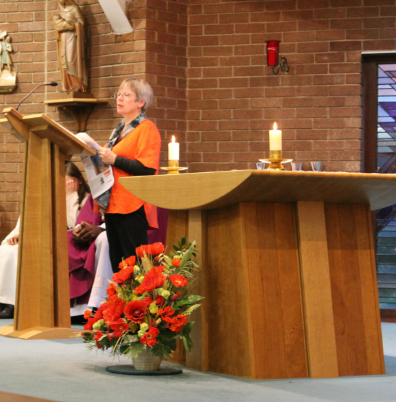 Education Volunteer Margret Wellington speaking at mass earlier this year