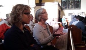 Susan (right) asks a CAFOD question to local candidates