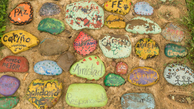 Stones in Colombia have messages of peace, friendship, faith and solidarity written on them. Credit Paul Smith
