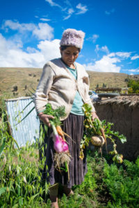 Rosa with her vegetable harvest, Bolivia