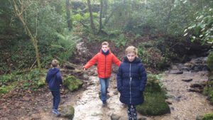 Children walk in the old quarry near Ponsanooth