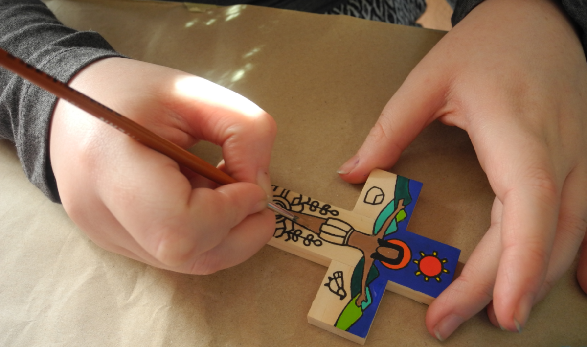 Painting a Romero Cross.