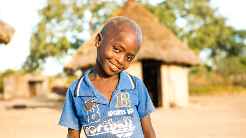 Svondo outside his home in Zimbabwe