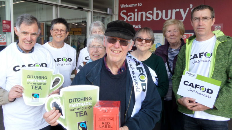 Vin Allerton (with the red box) with a group of CAFOD staff and volunteers. Campaigning in Salford telling Sainsbury's not to ditch Fairtrade.