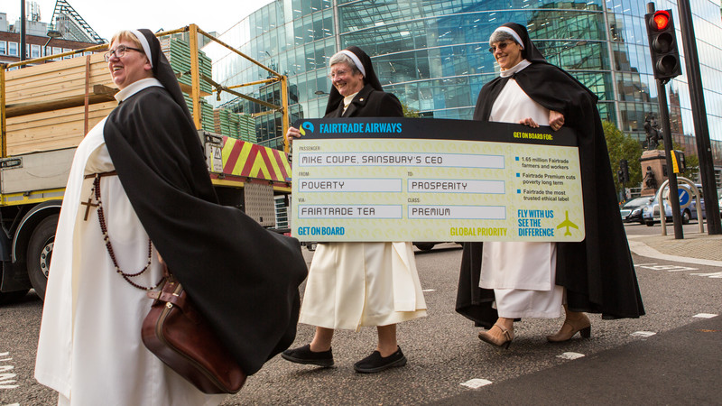 Sister Dominica, Sister Chris and Sister Karen took to the street to campaign for Fairtrade. They are carrying a giant boarding pass to hand over to Sainsbury's CEO Mike Coupe, to encourage him to visit Fair Trade farmers overseas and not ditch the Fairtrade label on Sainsbury's tea.