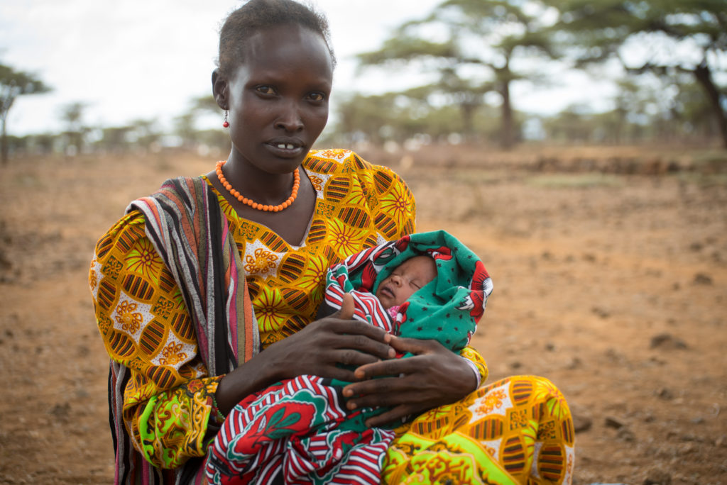 Lotom with one month old Eveline.