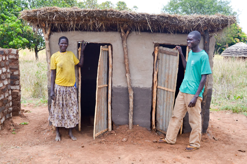 Monica and Samuel outside their new toilets.