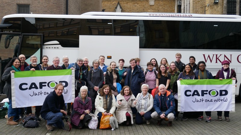 CAFOD staff and volunteers outside their coach on the way to COP24