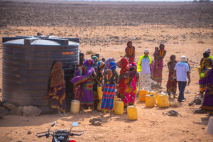 Community members collecting water from the water tank in Northern Kenya.