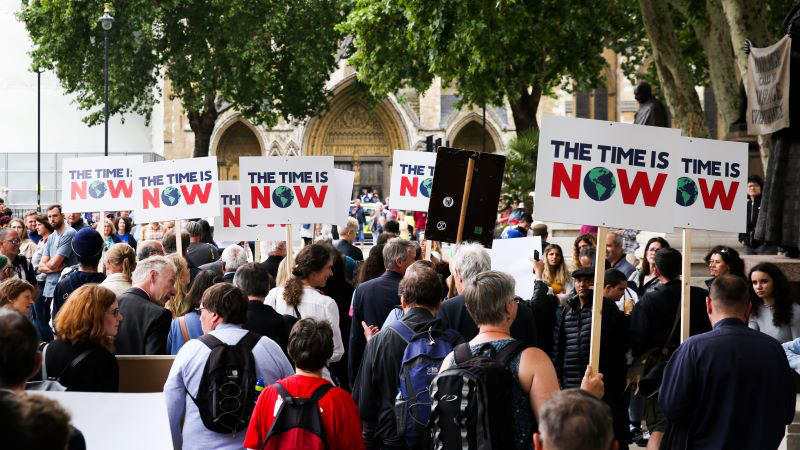 Supporters of The Time is Now lobby queue to speak to their MPs on climate change