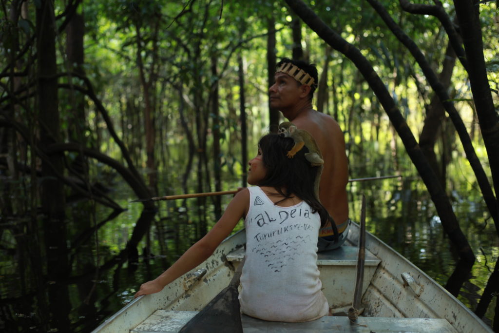 An indigenous Kambeba leader and his daughter fishing in the Brazilian Amazon.