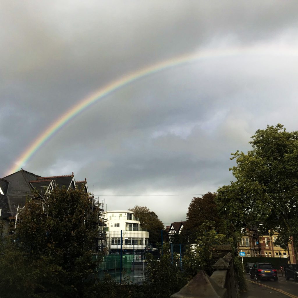 A rainbow in a cloudy sky