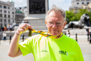 CAFOD runner celebrates completing the Half Marathon