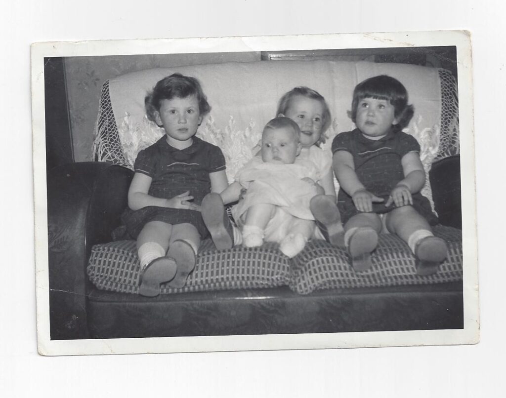 Maggie as a baby with sister Maureen